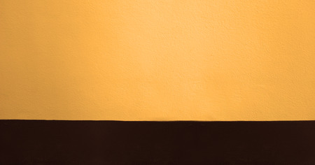 Orange cement wall texture backgroundの写真素材