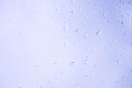 Water drops of rain on glass backgroundの写真素材