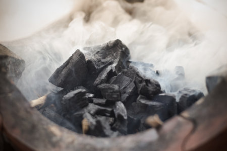 Charcoal BBQ blazing and glowingの写真素材