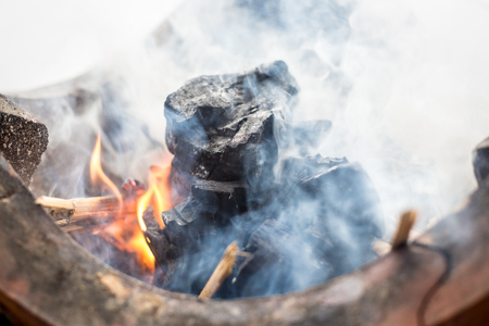 Charcoal BBQ blazing and glowingの写真素材