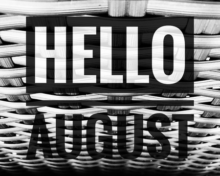 Hello August words on black and white wood chair background.の写真素材