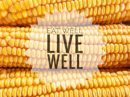 Eat well live well words on yellow corn background.の写真素材