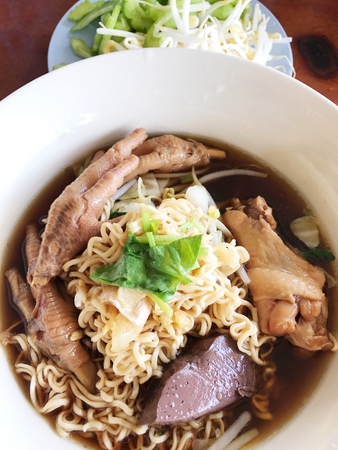 Braised chicken soup with bitter gourd noodle.の写真素材