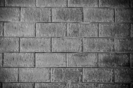 Old grey brick wall.backgroundの写真素材