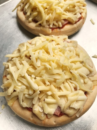 homemade pizza full of cheeseの写真素材