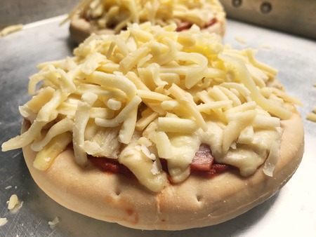 homemade pizza full of cheeseの写真素材