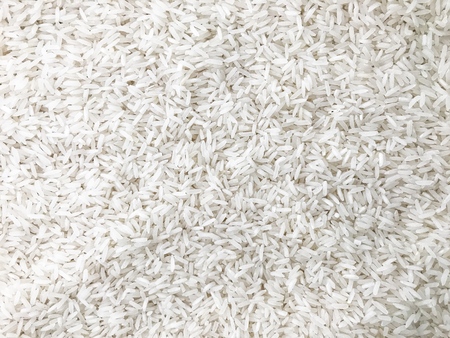 White uncooked rice, white backgroundの写真素材