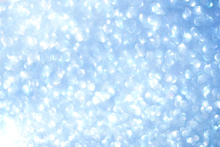 White blue glitter bokeh texture Christmas abstract backgroundの写真素材