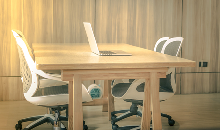 Office workplace with laptop, smart phone, cup of coffee on Comfortable work table, wood tableの写真素材