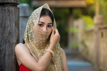 Thai woman wearing typical Thai dress, identity culture of Thailand.の写真素材