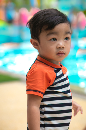 Asian boy swimming, portrait on swimming pool background.の写真素材
