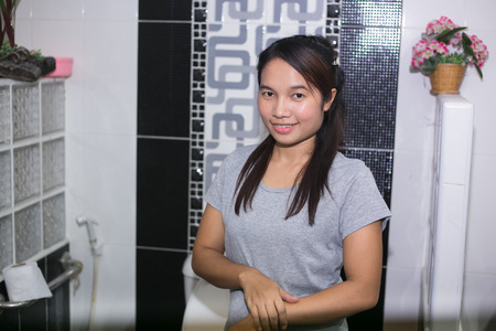 Asian woman smile in bathroomの写真素材