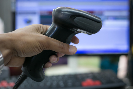 barcode scanner on blurred image in Supermarketsの写真素材