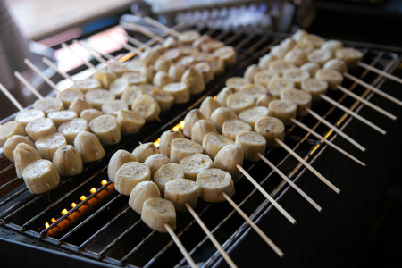 Grilled bananas for dessert being grilled on the rackの写真素材