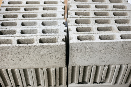 Cement or mortar, Cement powder with a trowel put on the brick at construction work.の写真素材