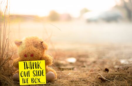 'Think out side the box' words on warm natural background, Motivational life quote and positive thinking.の写真素材