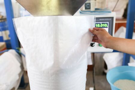 Rice packaging machine, rice filling, weighting and packing machine.の写真素材