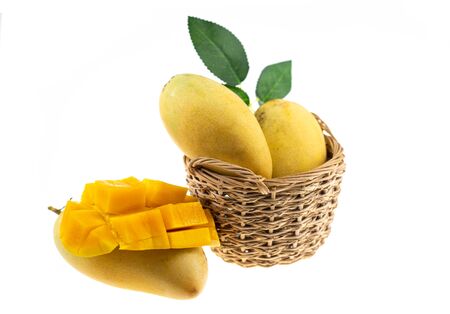 Yellow mango and mango slice isolated white background.の写真素材