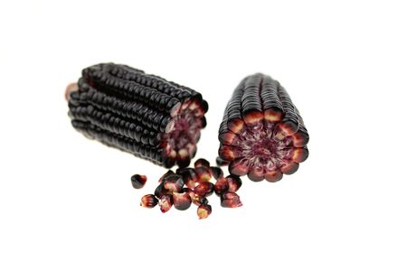 Fresh red corn isolated on white background. Grains of ripe cornの写真素材