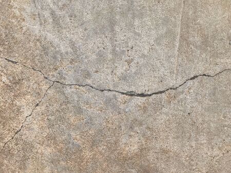 Grunge concrete cement floor with crack in industrial building. Cracked cement floor.の写真素材