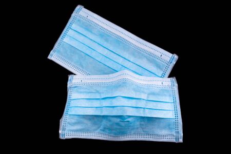 Medical mask of blue color for protection against flu or virus, epidemic and other diseases.の写真素材