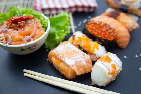 Sushi, Sashimi with chopsticks, Japanese sushi with soy sauce and wasabi.の写真素材