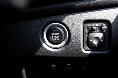 Start stop engine button on a modern car dashboard.の写真素材
