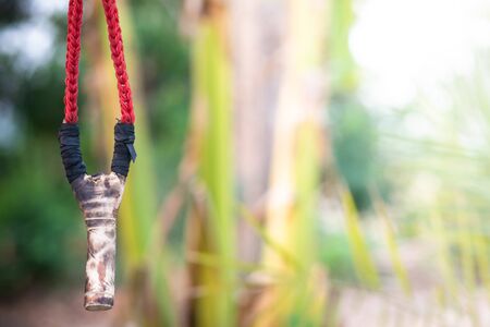 Wood catapult slingshot on natural background.の写真素材