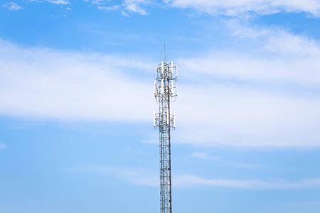 Telephone pole or cell tower in clear sky background.