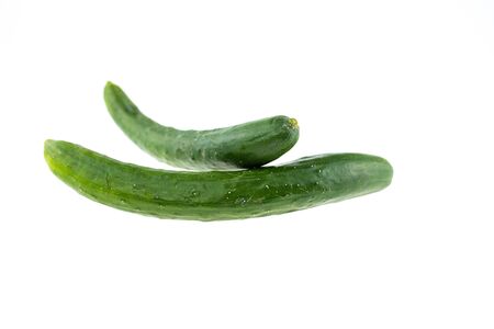 Long green cucumber isolated on white background.の写真素材