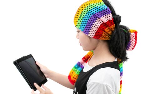 young woman using a tablet for work or selfie isolated on white.の写真素材