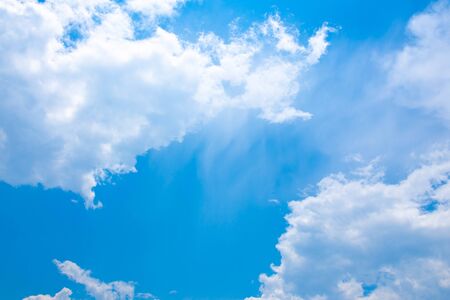 Clear blue sky with cloudsの写真素材