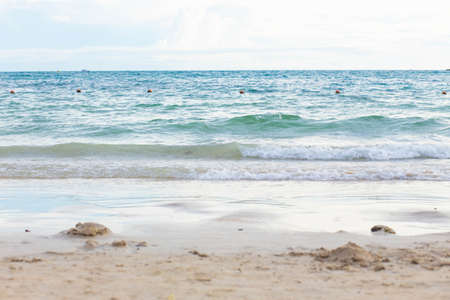 Ocean wave on tropical sandy beach in summer. Beautiful view.の写真素材