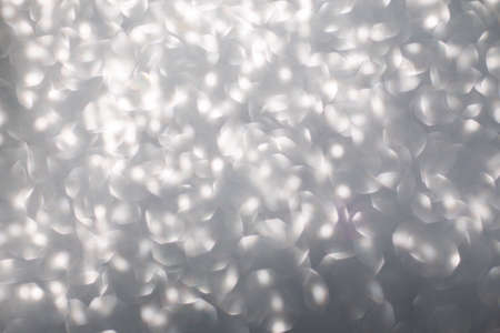 Silver glitter christmas abstract bokeh background. Blur bokeh background.の写真素材