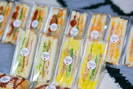 Sanwich including of vegetables, sliced cheese or ham. Homemade sanwich make it for sale, can use for breakfast meal.の素材 [FY310177085983]