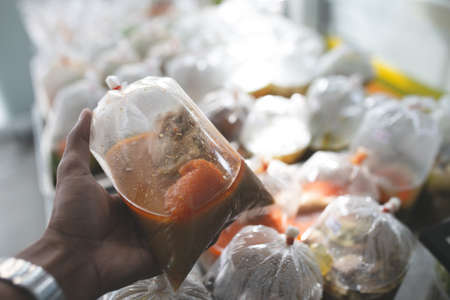 Food in plastic bags on street food of Thailand. Thai food ready to eat.の写真素材