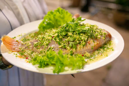 Fish steamed with lemon, Thai food.の写真素材