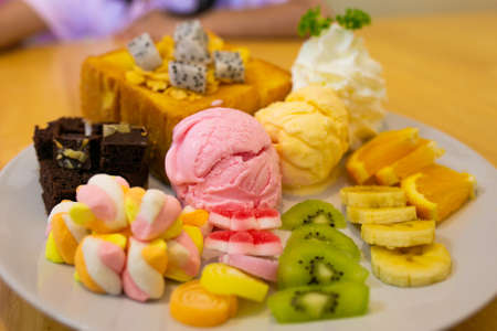 Honey toast, with vanilla and strawberries  ice cream serve with fresh fruits, delicious menu in the...