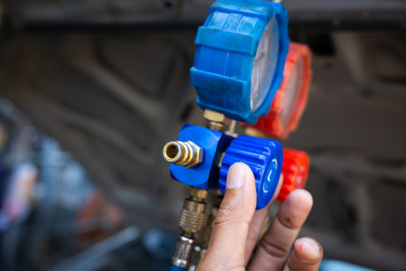 Close-up of mechanic hands holding oil filter in auto repair serviceの写真素材