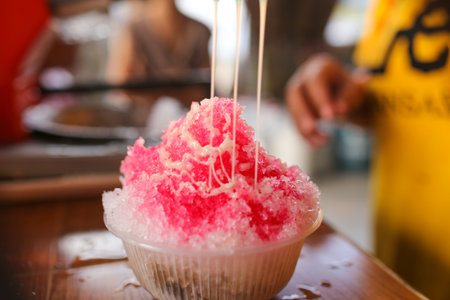 Strawberry ice cream on the table in street food market.の写真素材