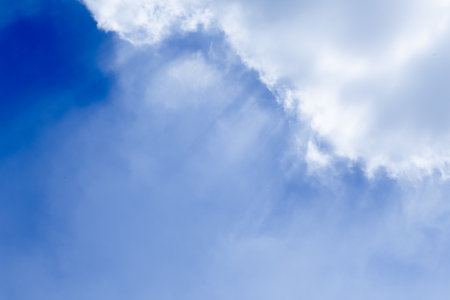 Blue sky background with tiny clouds. Abstract sky background with tiny clouds.の写真素材