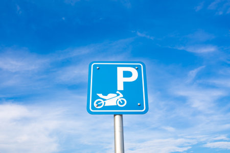 Parking sign on blue sky background. Copy space for text.の写真素材