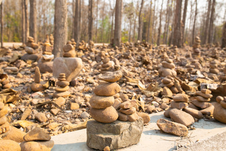 Stone cairns in the forest, Thailand. Selective focus.の写真素材