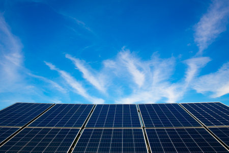 solar energy against blue sky with white clouds, closeup of photoの写真素材