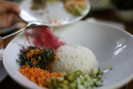 Rice and vegetables on the table in a restaurant, Thailand.の写真素材