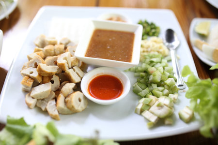 Fried pork with sweet and sour sauce on white plate, Thai foodの写真素材