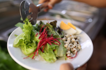 Vegetable salad on the table in the restaurant, stock photoの写真素材