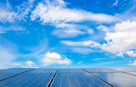 Solar panels against the blue sky with clouds. Solar energy concept.の写真素材