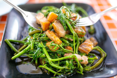 Stir Fried Water Spinach with Crispy Pork and Garlicの写真素材