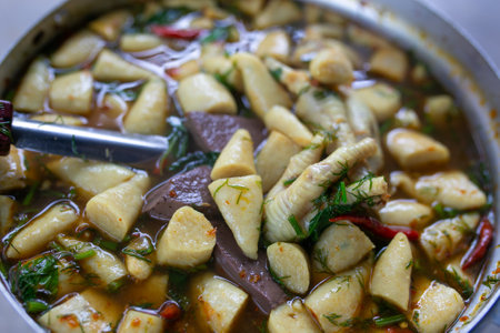 thai spicy soup with coconut milk and pork, thai foodの写真素材